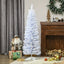 5-foot white pencil Christmas tree with snow flocked branches in a cozy living room setting