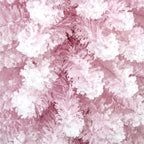 Close-up of snow-flocked branch texture on the pink artificial tree