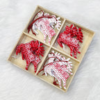 Handcrafted wooden Christmas bell pendant in red and white for holiday tree decoration