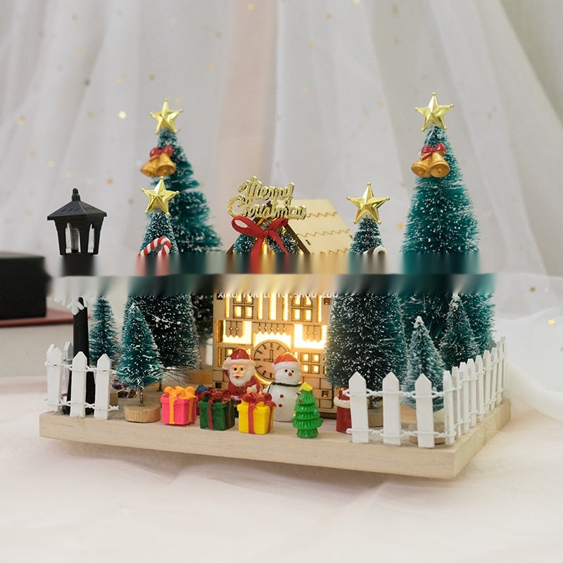Christmas cabin ornament featuring solid wood and warm interior lighting