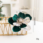 Set of festive flannel Christmas flower ornaments in holiday setting