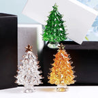Platinum crystal Christmas tree ornament sparkling against dark background