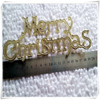Close-up of gold plastic Christmas letter pendant detail on tree