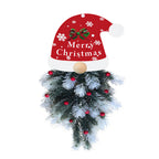 Christmas pine garland pendant displayed on window with winter scene visible outside