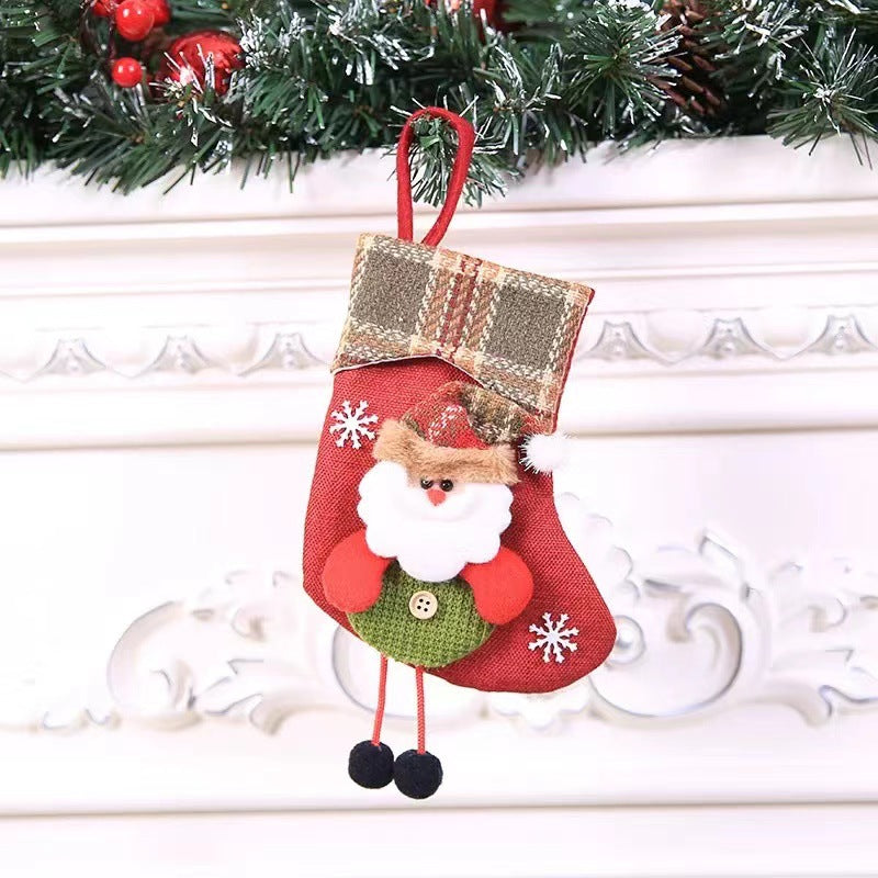 Christmas decoration featuring plaid fabric stocking designs with hanging loop