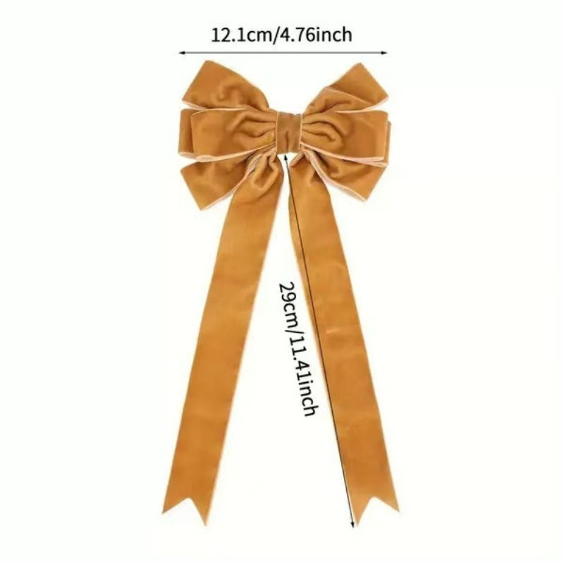 Christmas decoration pendant with bowknot garland design in rich red tones