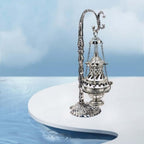 Hanging incense censer suspended from decorative chain