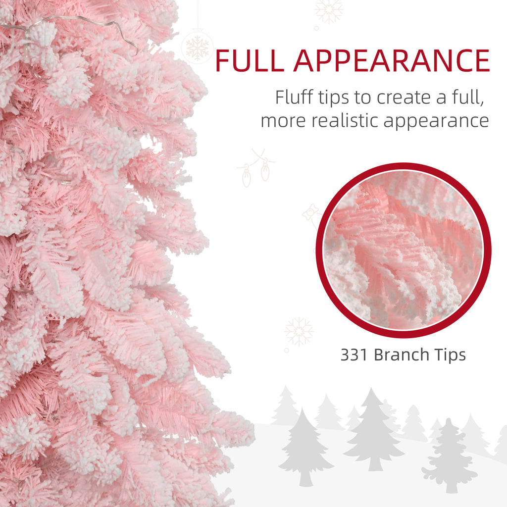 Family gathering around a lit pink Christmas tree during the holiday season