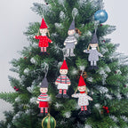 Wooden holiday ornaments showcasing Christmas tree boy girl theme