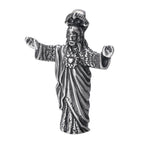 Sterling silver vintage Jesus pendant displayed against dark background