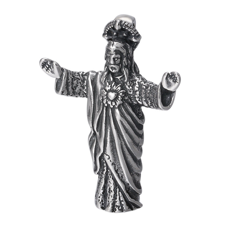 Sterling silver vintage Jesus pendant displayed against dark background