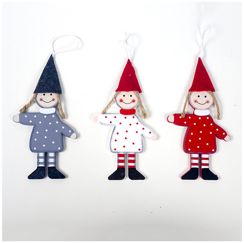 Wooden Christmas tree boy girl ornament set laid out flat showing details