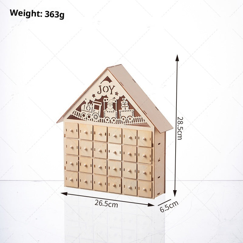 Wooden Advent calendar with soft LED glow on festive surface