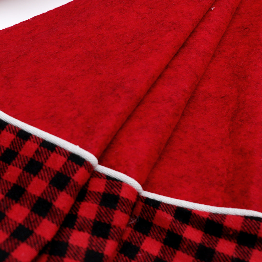 Christmas tree skirt in black and red plaid with cloth fabric texture for traditional holiday decorating
