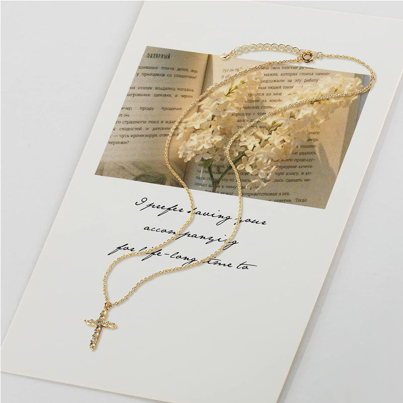 Gold cross pendant necklace with cubic zirconia stones