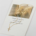 Gold cross pendant necklace with cubic zirconia stones