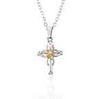 Close-up of cross and flower pendant detail, faith symbol jewelry