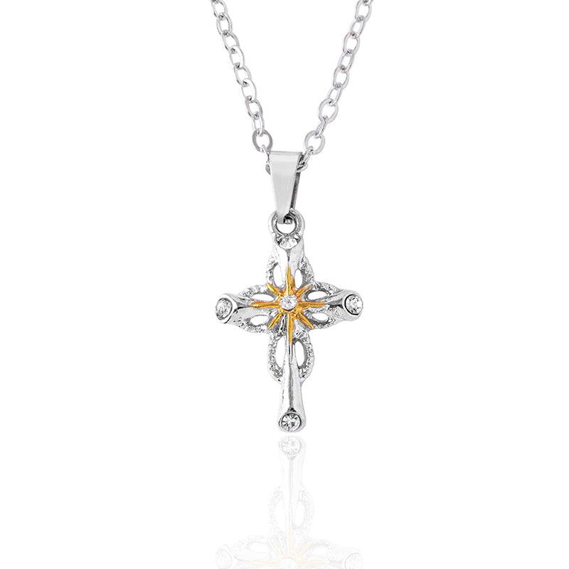 Close-up of cross and flower pendant detail, faith symbol jewelry