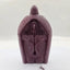Resin Jesus figurine ornament displayed as wall hanging in modern home setting