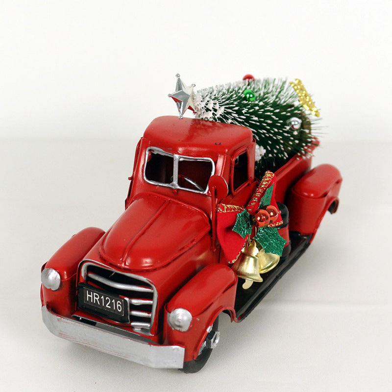 Red retro truck ornament displaying farmhouse Christmas charm on tree