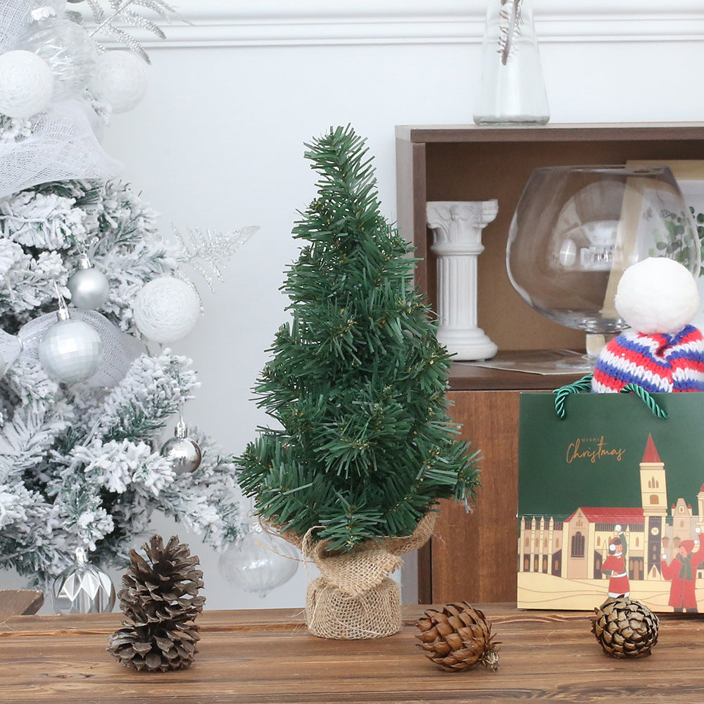 Christmas tree window decoration on illuminated windowsill during holiday season, warm home atmosphere