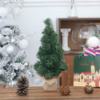 Christmas tree window decoration on illuminated windowsill during holiday season, warm home atmosphere