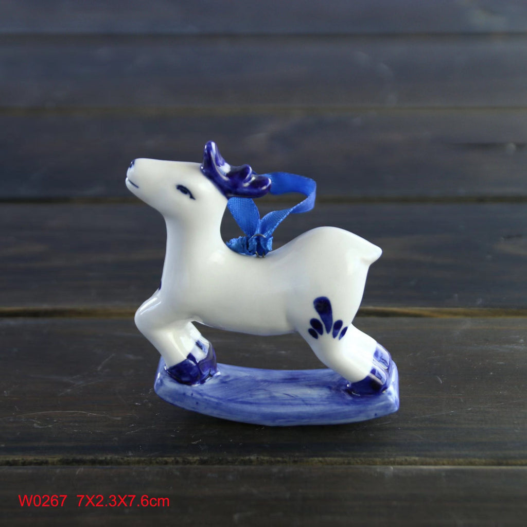 Classic blue and white porcelain ornament against festive green branches