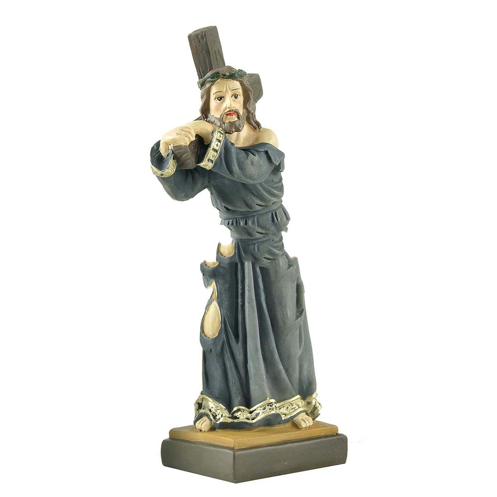 Resin craft of Jesus displayed on wooden surface, soft lighting