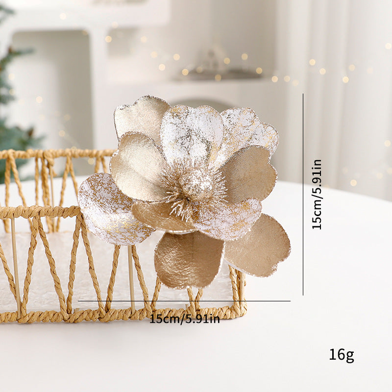 Christmas tree decorated with flannel flower ornaments and greenery