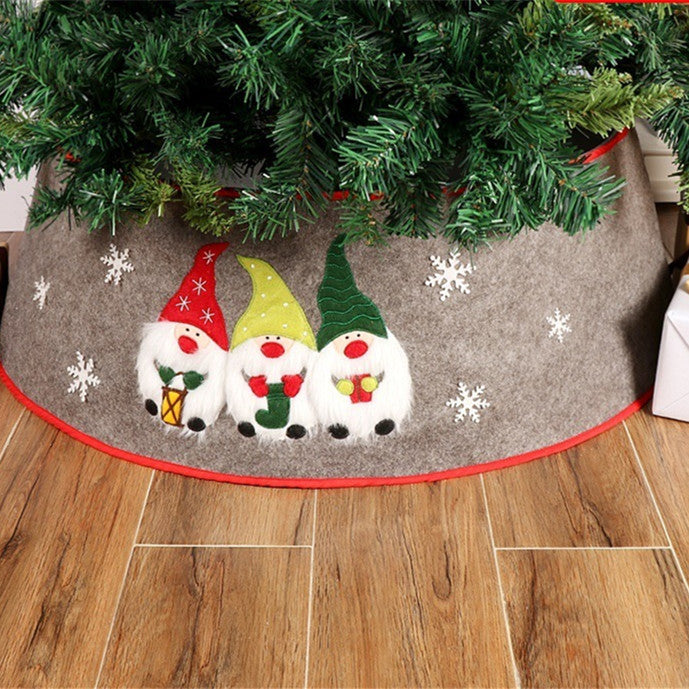 Non-woven fabric tree apron showing festive Nordic elders design detail close-up