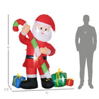 Festive outdoor Christmas display featuring blow-up Santa with candy cane and gift boxes illuminated by white LED lights