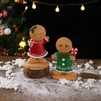 Gingerbread man Christmas ornament surrounded by holiday greenery and berries