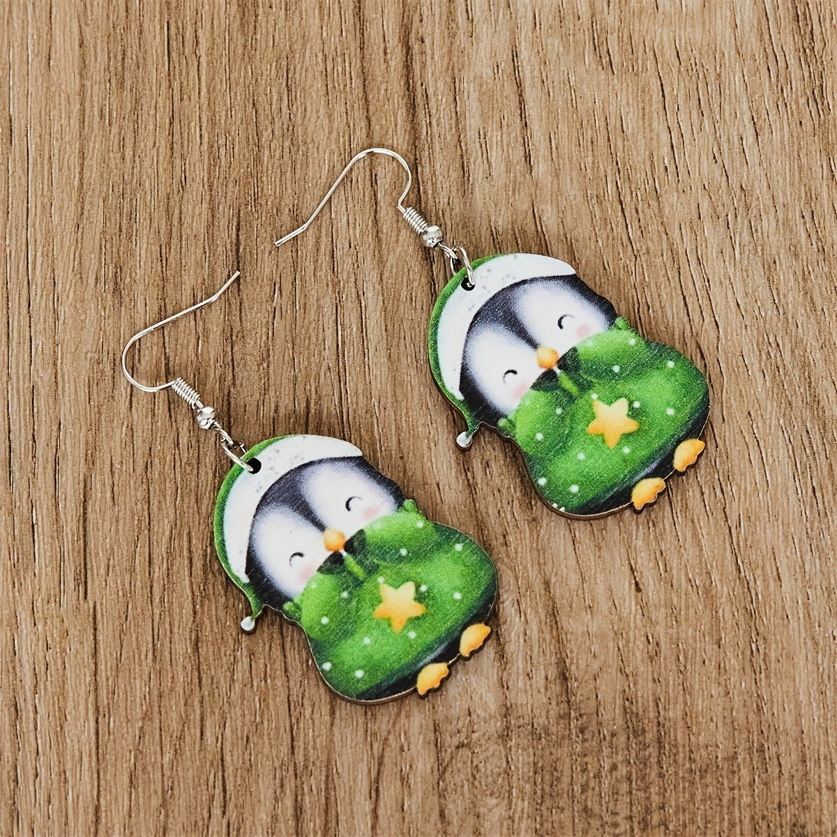Holiday penguin earrings styled for Christmas gift giving