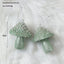 Flocked dark green Christmas ball ornament on tree - Christmas decor