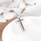 Two cross necklaces displayed together