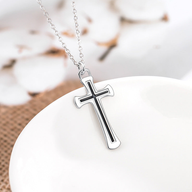 Two cross necklaces displayed together