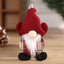 Dancing Santa Claus fabric doll pendant in festive Christmas setting