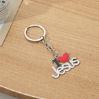Jesus pendant keyring hanging from car keys outdoors
