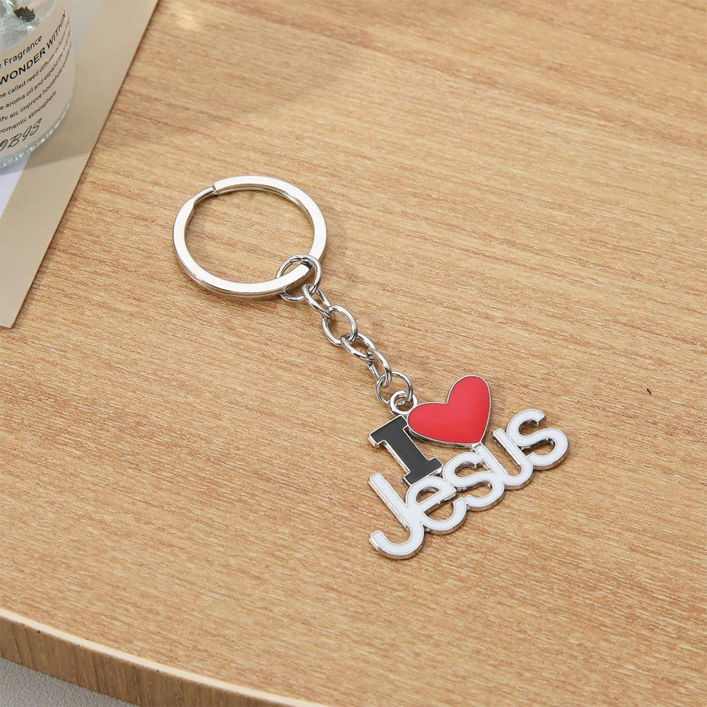 Jesus pendant keyring hanging from car keys outdoors