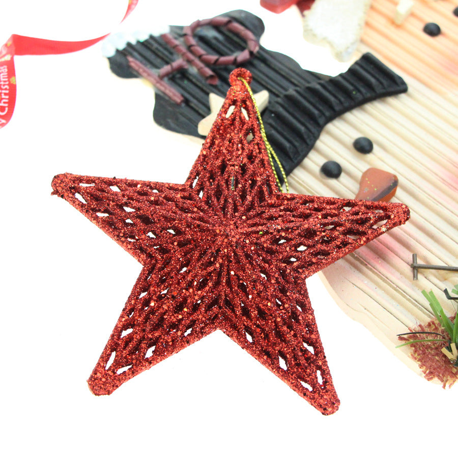 Three-dimensional plastic star decoration catching light at various angles