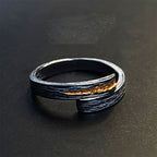Bold cross ring worn on index finger