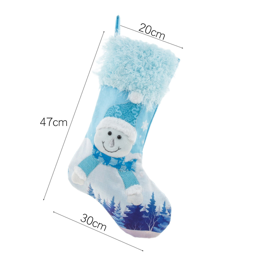 Blue plush Christmas stocking close-up showing soft luminous glow and quality fabric