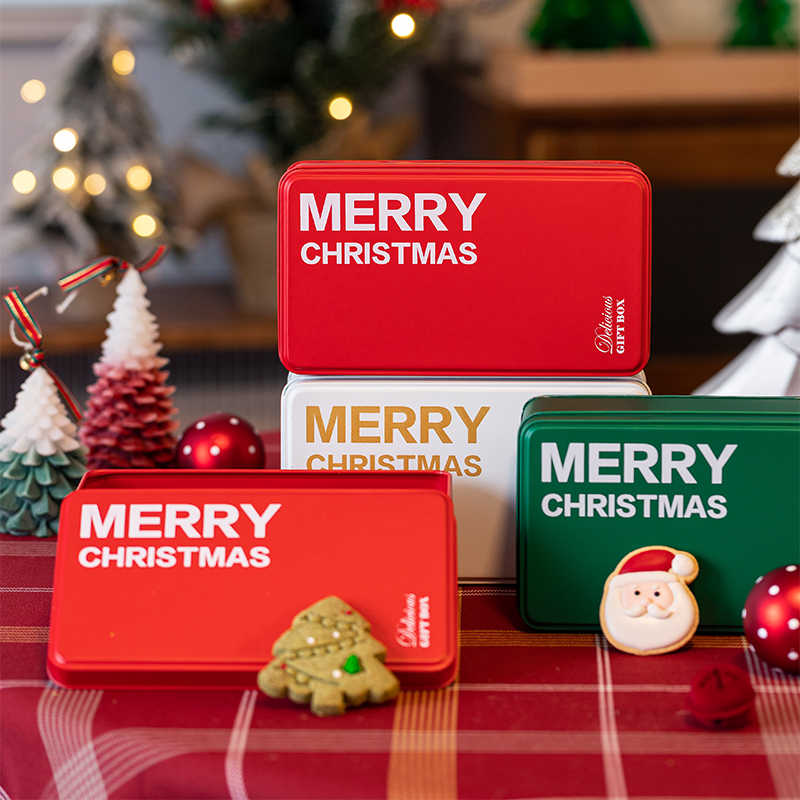 Green packaging tin with white pattern showing Christmas cookie presentation