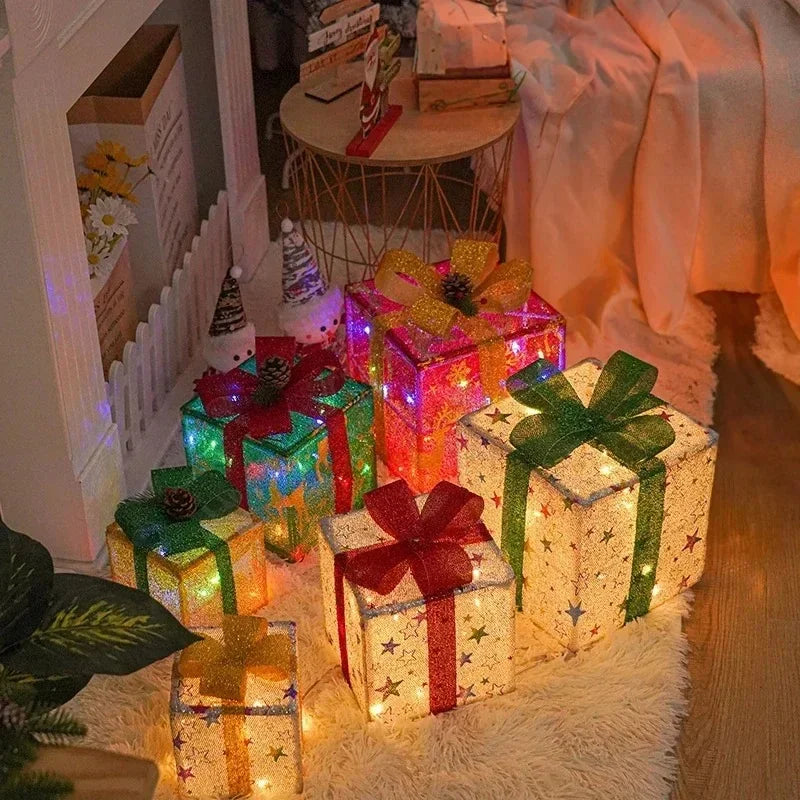 Christmas gift boxes with bows featuring tinsel glitter fabric detail