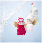 Christmas angel ornaments arranged for seasonal display