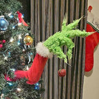 Multiple green prosthetic leg ornaments arranged together