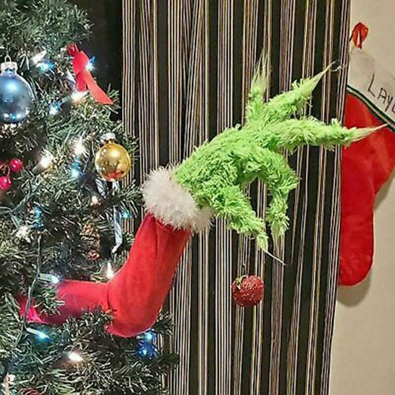 Multiple green prosthetic leg ornaments arranged together