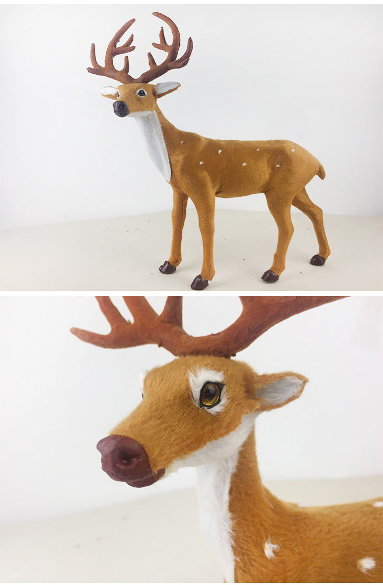 Festive arrangement of deer ornaments among pine branches and ornaments