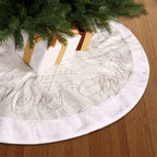Snowflake letter Christmas tree skirt displayed on a decorated tree
