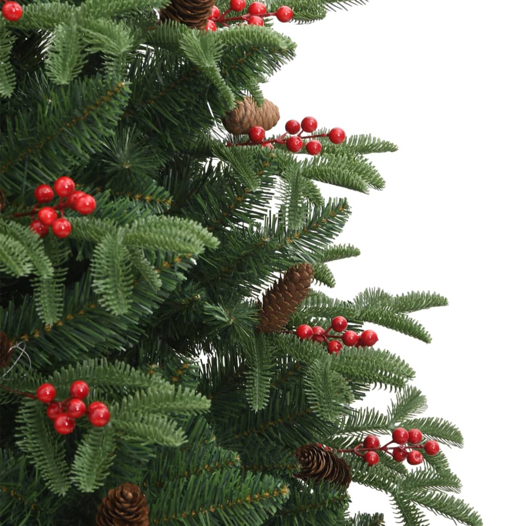 Artificial Christmas tree with cones and berries in a warm holiday room setting